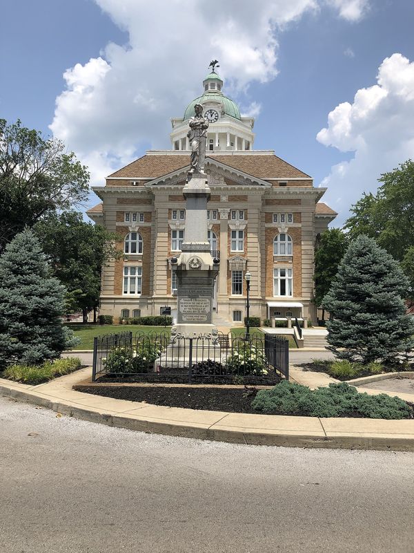 Front of the Giles County Courthouse with its dome, behind a landscaped lawn