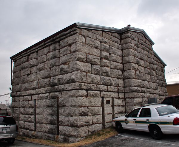A two-story jail built of large rough-cut stone blocks