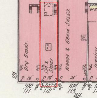 April 1914 Sanborn fire insurance map detail with the lot at today&rsquo;s 102 College St. E. outlined in red; the map labels it: clothing and shoes