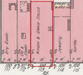 April 1914 Sanborn fire insurance map detail with the lot at today&rsquo;s 104 College St. E. outlined in red; the map labels it: wagon and grain sales