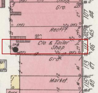 April 1914 Sanborn fire insurance map detail with the lot at today&rsquo;s 113 Main Ave. S. outlined in red; the map labels it: clothing and tailor shop